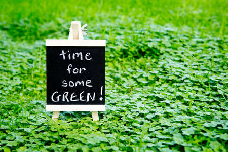 Time for Some Green - handwritten on blackboard in green cloverの写真素材
