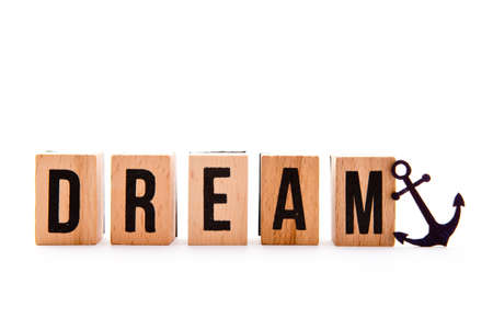 Dream Boat - wooden block letters and anchor icon on white backgroundの写真素材