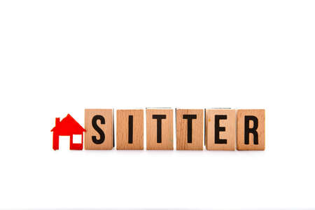 House Sitter - block letters with red home / house icon with white backgroundの写真素材