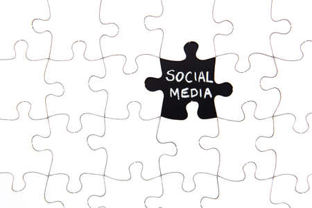 Puzzle Pieces - with word Social Media in black chalkboard spaceの写真素材