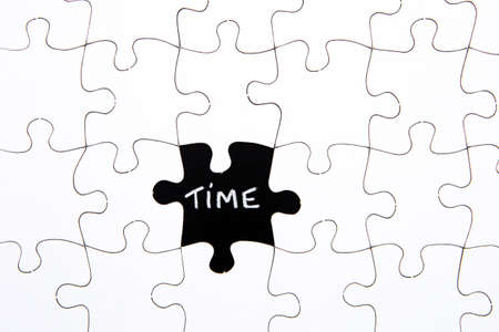 Puzzle Pieces - with word Time in black chalkboard spaceの写真素材