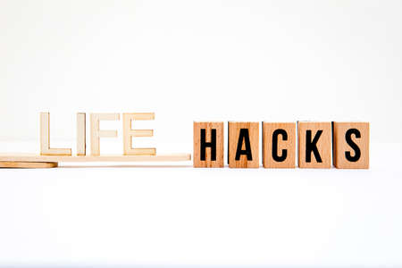 Life Hacks in wooden letters with white backgroundの写真素材