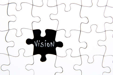 Puzzle Pieces - with word Vision in black chalkboard spaceの写真素材