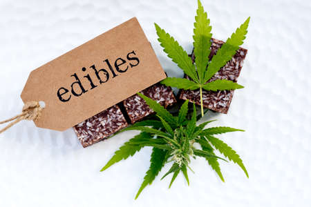 Marijuana - Cannabis - Medicinal Edibles - Coconut Brownies with tag, leaf and budの写真素材