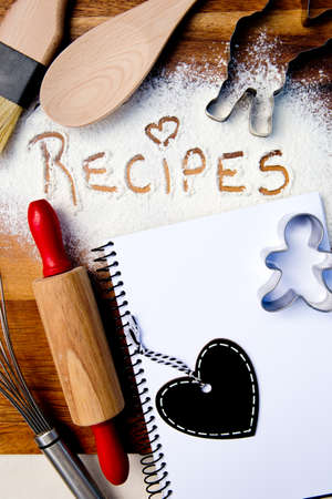 Recipes with note book and heart blackboard - written in flourの写真素材