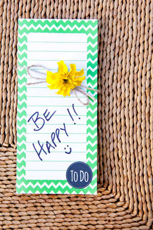 To Do List - Be Happy on straw mat backgroundの写真素材
