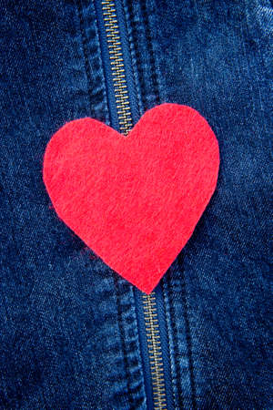 Red Felt heart on denim backgroundの写真素材