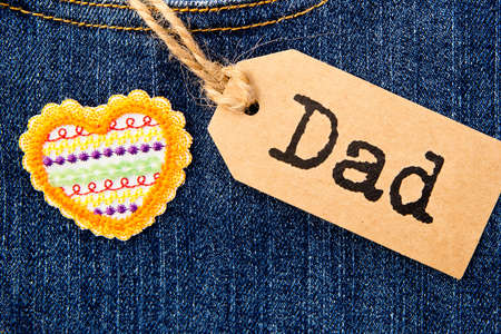 Dad tag with heart on blue denimの写真素材