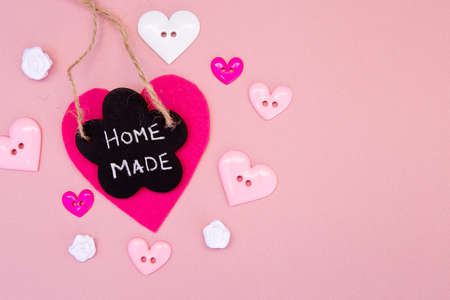 Sewing - Home Made - with buttons on pink backgroundの写真素材