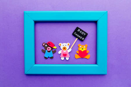 Baby Shower - bears with blackboard sign on purple background with turquoise frameの写真素材