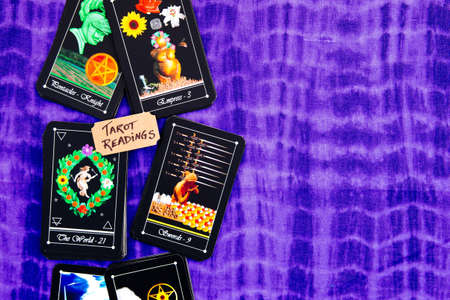 Tarot readings with deck of Tarot cards on puple reading clothの写真素材