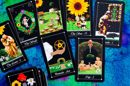 Tarot readings with deck of Tarot cards on multi colored silk reading clothの写真素材