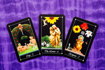 Tarot readings with deck of Tarot cards - purple cloth backgroundの写真素材