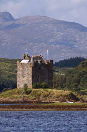 Castle Stalker is an authentic medieval tower house situated on an islet on Loch Laich on the north-west coast of Scotland amidst truly spectacular mountain scenery.の写真素材