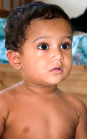 A surprised Indian kid looking astonished and surprised 