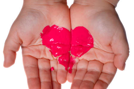 Hands with a painted heart. Love, kids love. Love symbol.の写真素材