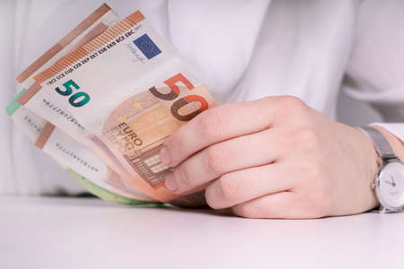 Hand with banknotes. European currency. Business and finance. Economy and banking in Europe.の写真素材