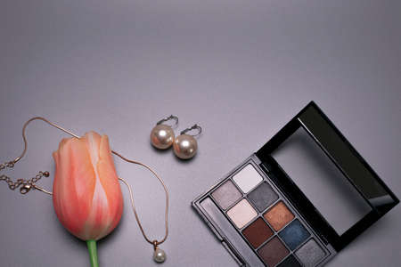 Beauty background with jewelry and flower, with free space for text.の写真素材