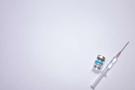 COVID-19 Vaccine on the white background. Healthcare and medical concept. Free space for text.の写真素材