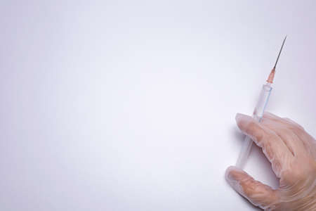 Syringe with vaccine on the white background. Healthcare and medical concept. Free space for text.の写真素材