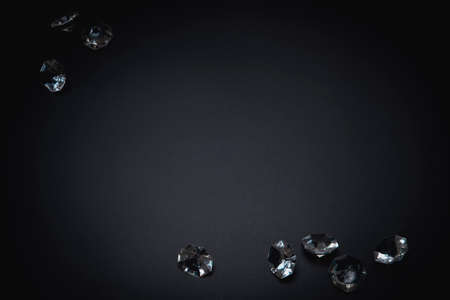 Elegant background, template for text or logo. Diamonds on the black background. Free space, copy space. Fashion, beauty backdrop.の写真素材