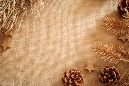 Christmas composition with natural colors and materials. Xmas background. Decoration elements, pine cones. Free space for text, copy space. Flat lay, top view.の写真素材