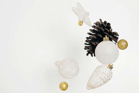 Flying Christmas decoration on the white background. Christmas composition. Free space, copy space....