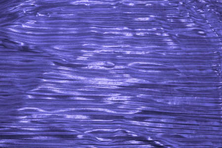 Shiny fabric in color of the Year 2022, Very Peri. Abstract background. Events, celebrations,...