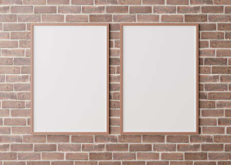 Two blank vertical picture frames hanging on brown brick wall. Template, mock up for your picture or...