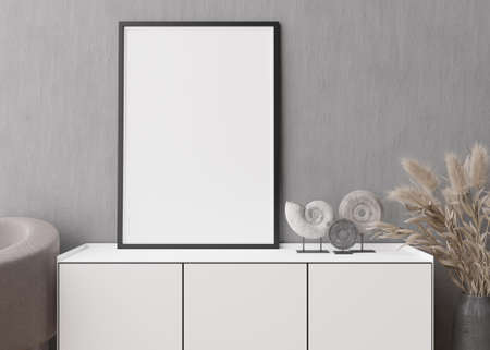 Empty vertical picture frame on gray concrete wall in modern living room. Mock up interior in...