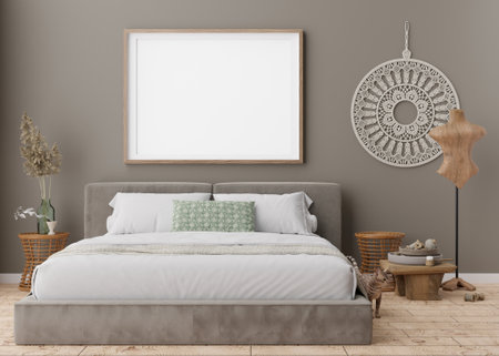 Empty picture frame on grey wall in modern bedroom. Mock up interior in boho style. Free, copy space for your picture, poster. Bed, rattan table, pampas grass, macrame, cat. 3D rendering.の写真素材