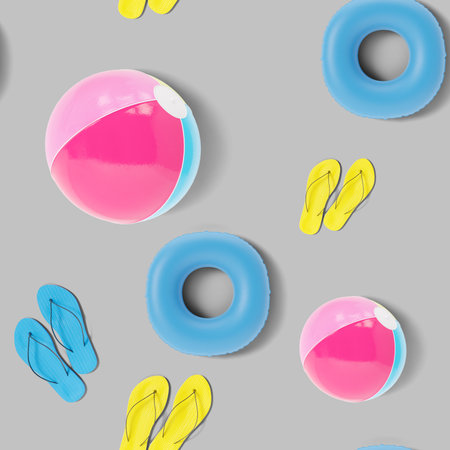 Seamless pattern with beach accessories on gray background. Colorful summer background, texture. top...