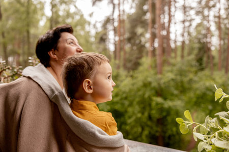 Happy grandmother and grandson enjoy time together. Positive middle age woman spending time with little, cute grandchild, having fun. 50-year-old grandma with grandkid. Multi-generational family.の写真素材