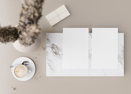 Two white vertical flyer mock ups with vase and other home accessories on beige table. Paper sheet, blank template for your design. Top view, close-up. Brochure, invitation presentation. 3D rendering.の写真素材