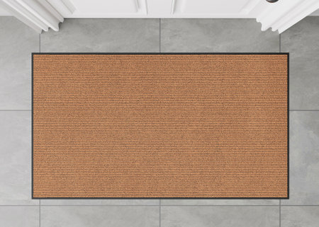 Blank brown door mat on the floor at home. Welcome mat with copy space for your text. Doormat mock up. Carpet at entrance for wiping dirty shoes. Mockup. 3D Rendering.の写真素材