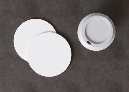 White, round cup coaster mock up. Blank template for your design, advertising, logo. Top view, close-up. Copy space. Drink mat, pad. Minimalist mockup. 3D rendering.の写真素材