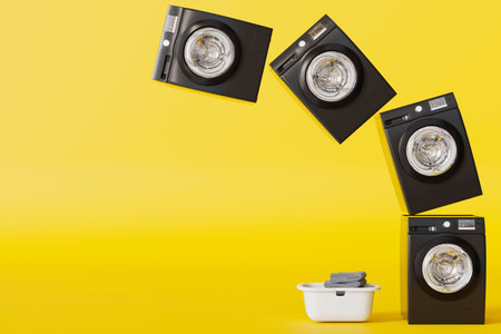 Washing machines levitation, public laundry concept. Yellow background, copy space for text....