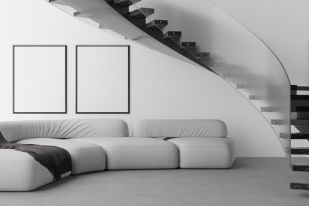 Modern living area features a sleek sofa in grey tones complemented by blank frames on the wall. This open space invites personalization and creativity with its minimalist design. 3D render.の写真素材