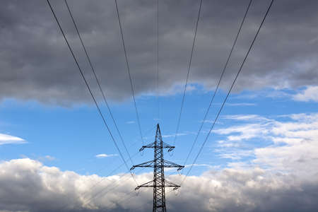 Power Supply tower in front of some impressive cloudy skyの写真素材