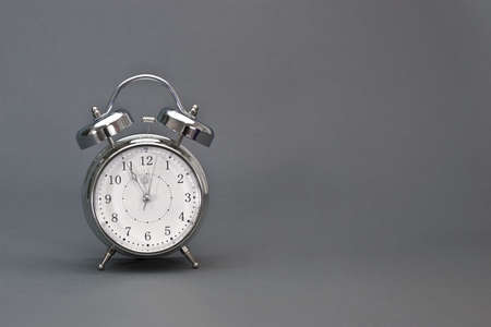Time is running out fast   Alarm clock shows the highest time with copy space on the right の写真素材