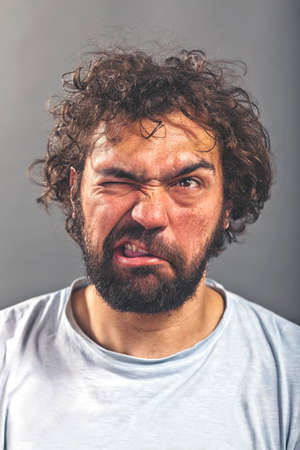 Weird guy making a crazy faceの写真素材