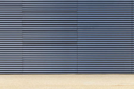 Light gray and blue wall of metal gratingsの写真素材