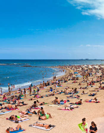 Crowded beach of Barceloneta in summer time. Barceloneta Beach is one of the most popular beach in the city of barcelona - Spainのeditorial素材