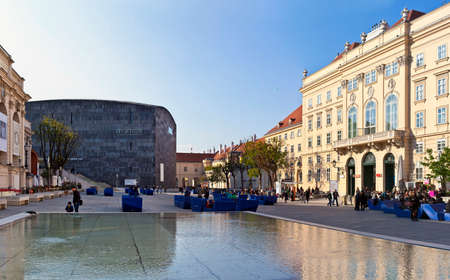 VIENNA, AUSTRIA - APRIL 17: Many people enjoy a sunny afternoon at the Museumsquartier on April 17, 2014 in Vienna, Austria. It is the eighth largest cultural area in the world.のeditorial素材