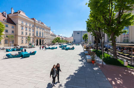 VIENNA, AUSTRIA - APRIL 29, 2016: Many people enjoy a sunny afternoon at the Museumsquartier in Vienna. It is the eighth largest cultural area in the world.のeditorial素材