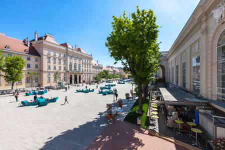 VIENNA, AUSTRIA - APRIL 29, 2016: Many people enjoy a sunny afternoon at the Museumsquartier in Vienna. It is the eighth largest cultural area in the world.のeditorial素材