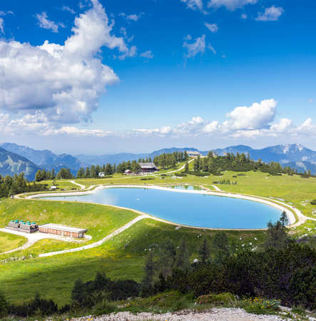 View from the mountain top called Hoess at the Austrian Alps. The Hoes is part of the Village Hinterstoder in Upper Austria and especially known for his famous world cup ski races in winter.の写真素材