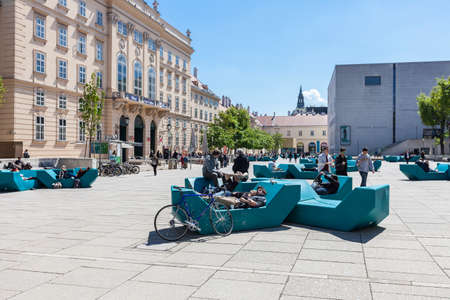 VIENNA, AUSTRIA - APRIL 29, 2016: Many people enjoy a sunny afternoon at the Museumsquartier in...
