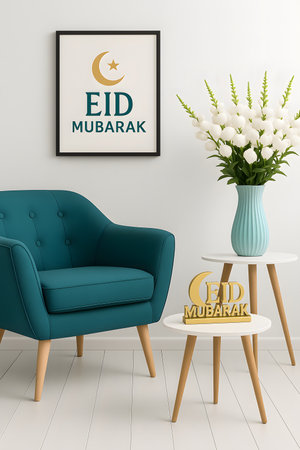 Eid mubarak interior showcasing framed islamic art featuring golden moon and star above eid mubarak text, complemented with modern teal colored chair and round table decorated with islamic eid mubarak sign. Decoration conceptの素材