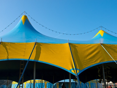 Roof of a blue and yellow circus tentの写真素材